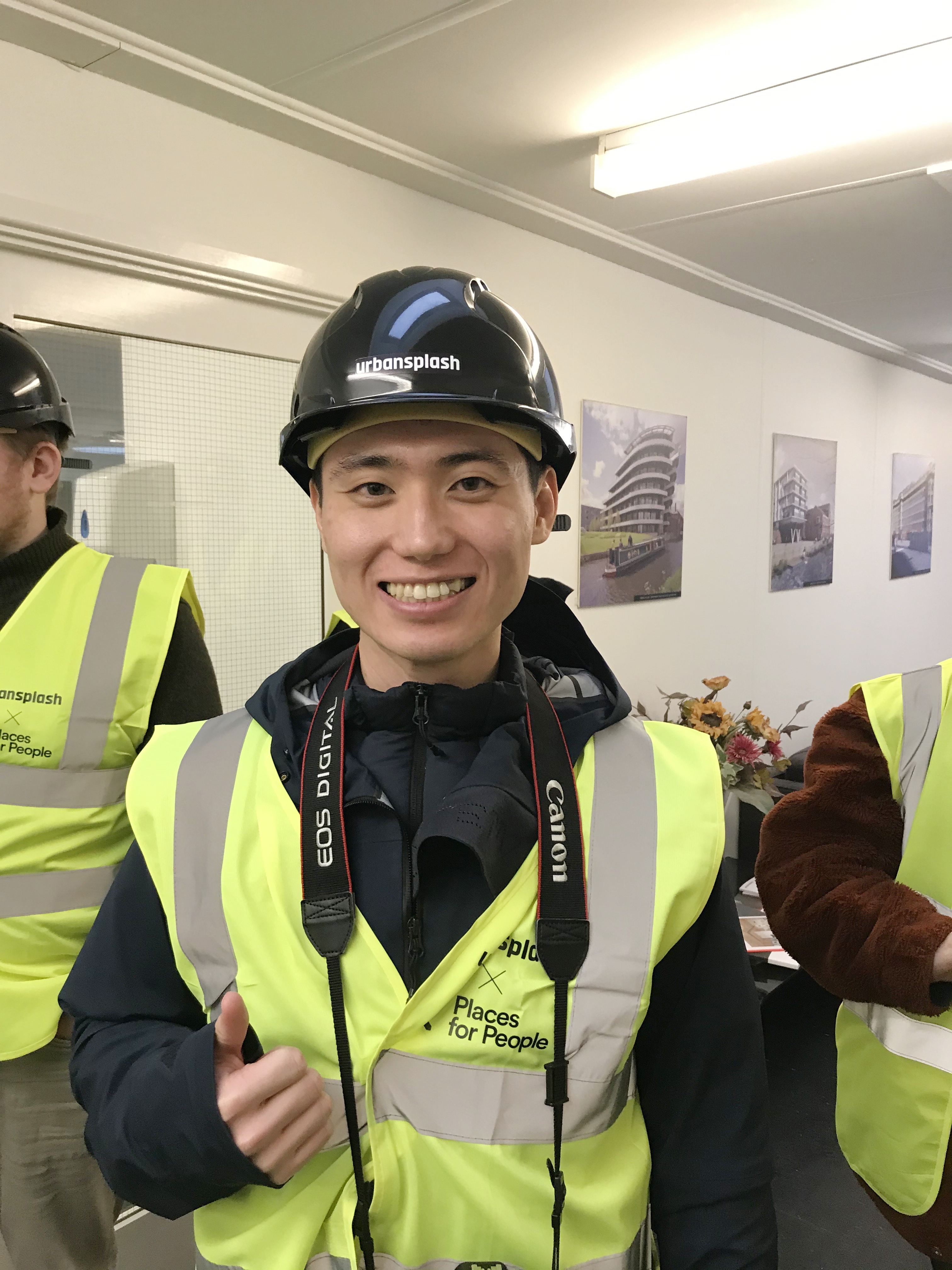 A student in hi-viz and a helmet